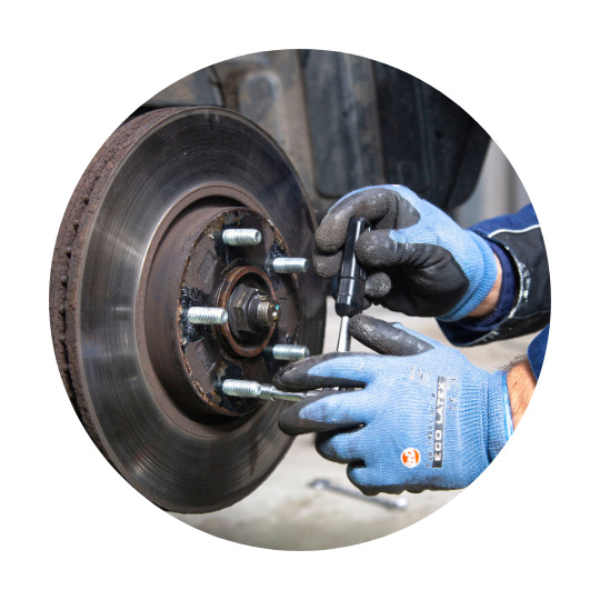 Brake paste being applied to a car wheel